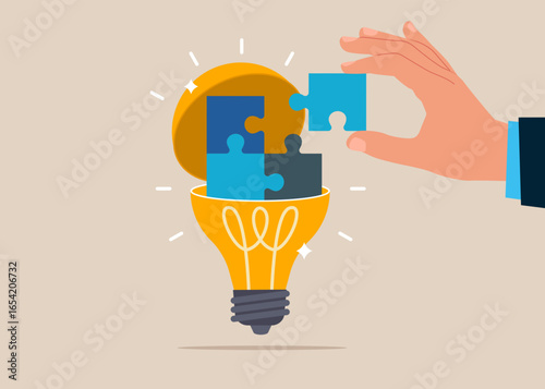 Business merger and acquisition. Teamwork and collaboration. Connect jigsaw puzzles in light bulb. Creativity to help see business opportunity, vision to discover new solution or idea, curiosity