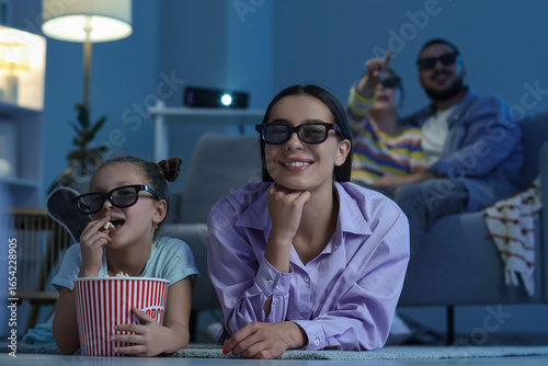 Happy family with 3D glasse...