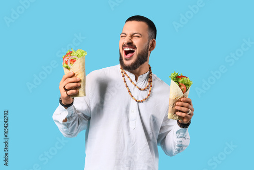 Happy young Muslim man with...