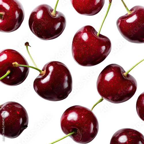 A vibrant close-up showcases numerous ripe, dark-red cherries, glistening with a natural sheen, arranged against a stark black backdrop
