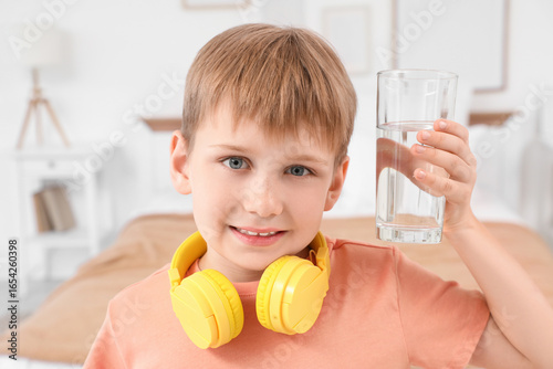 Cute little boy with headph...