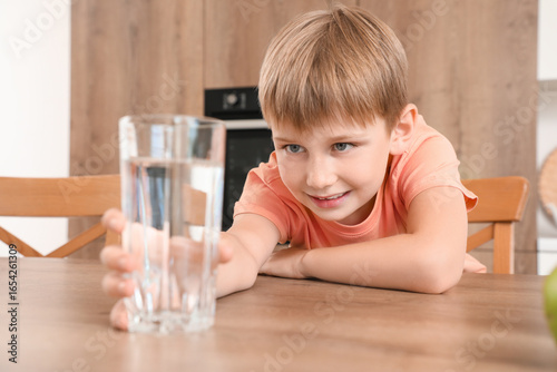 Cute little boy looking at ...