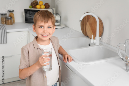 Cute little boy with glass ...