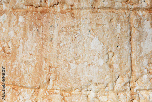 Vintage aged wall with texture showing effects of weather and time. Background photo. Copy Space. White and orange neutrals