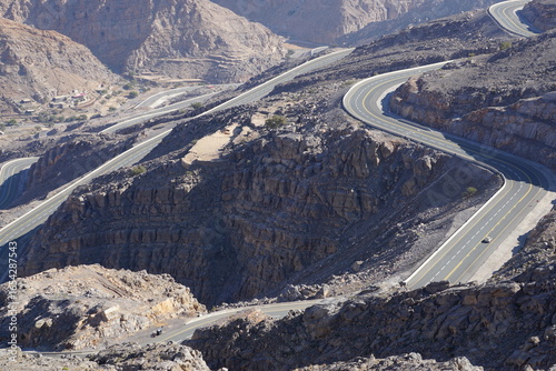 A winding mountain road through rocky terrain at Jebel Jais in the United Arab Emirates