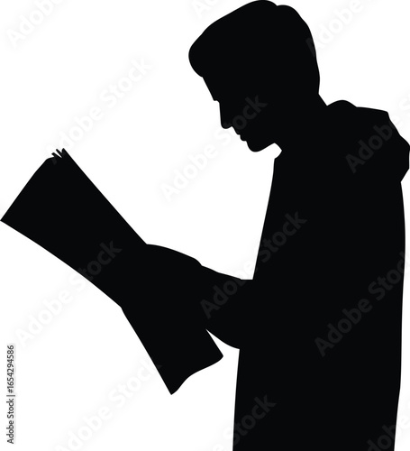 Young person deeply focused on reading a document in silhouette