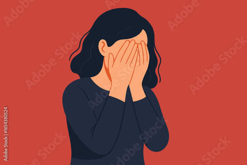 Woman suffering from depression covers her face with hands. Concept of mental health disorder, anxiety, stress, burnout, grief, sadness, fear, and psychological problem.
