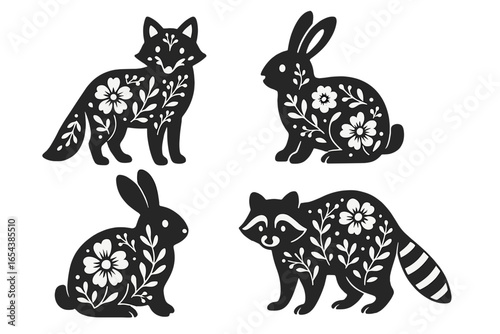 Collection of forest animal silhouettes. Fox, rabbit, raccoon with scandinavian folk art floral pattern. Cute black and white vector icons for nursery, print design, decor.