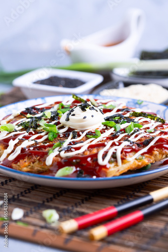 Okonomiyaki - traditional Japanese dish.