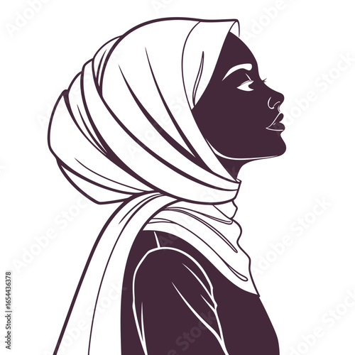 Elegant silhouette of a woman wearing a hijab in profile view