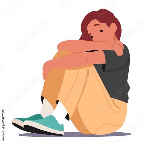 Sad frustrated teenage girl hugging knees with hands sitting on floor isolated on white background