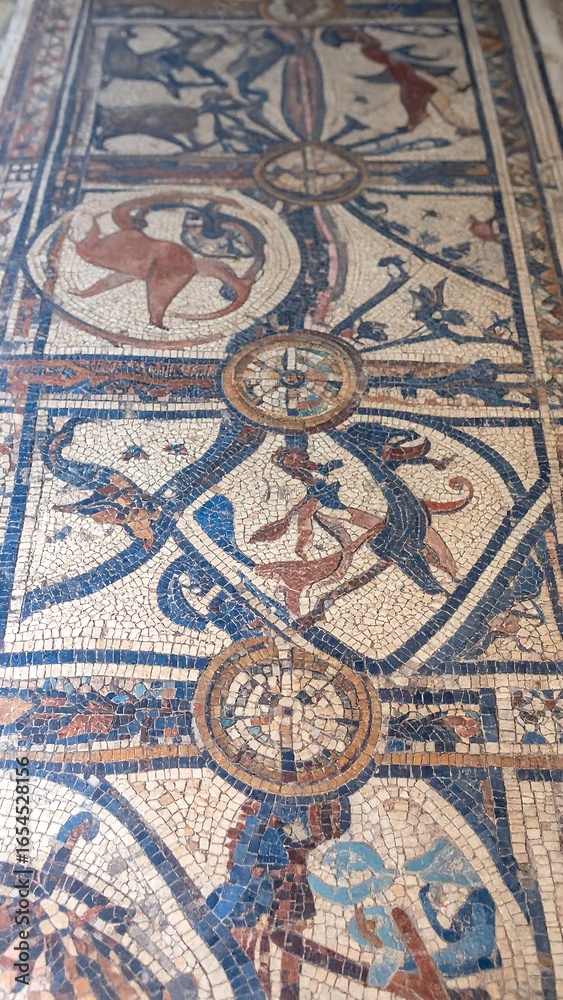 Obraz premium Ancient mosaic floor design with animal figures and geometric patterns