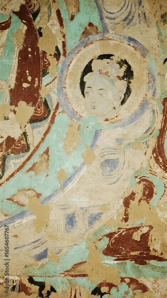 Fototapeta premium Ancient Mural Depicting a Serene Figure with Halo, Set Against a Turquoise Background