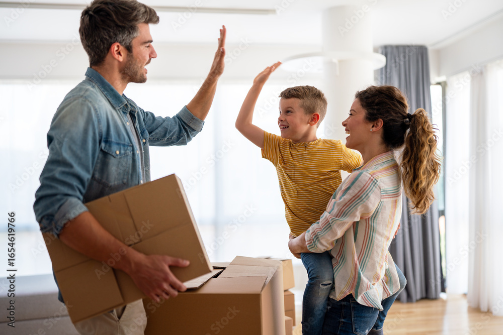 custom made wallpaper toronto digitalHappy family with child moving with boxes in a new apartment house. Mortgage, real estate investment