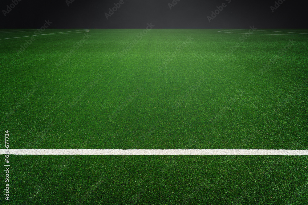 Obraz premium textured soccer game field with isolated, free copy space background - stadium center, midfield