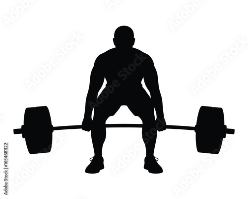 Silhouette of a weightlifter performing a deadlift