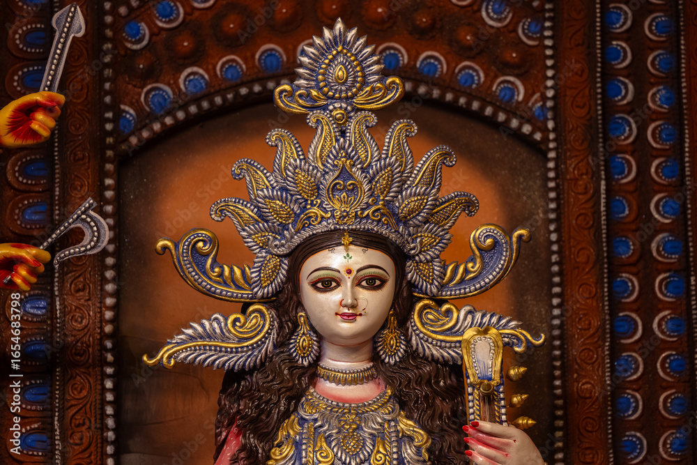Fototapeta premium Subho mahalaya, An handmade idol of Goddess Durga decorated in colorful Pandal. Durga Puja is biggest religious festival of Hinduism and for bengalis and is now celebrated worldwide.