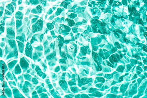 Rippling water surface with sunlight reflections