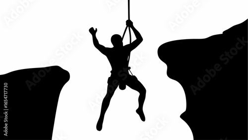 Silhouette of a climber suspended on a rope between two cliffs against a white background in monochrome