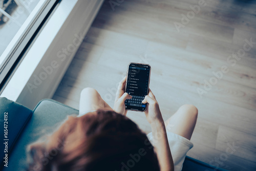 teenager orders food delivery from the restaurant on iPhone