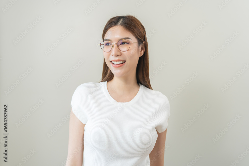 Portrait of beautiful asian young woman happy wearing glasses and smiling, cute girl with new eyeglasses sitting relaxed with copy space isolated on background. Health care of optical people concept. Portrait of beautiful asian young woman happy wearing glasses and smiling, cute girl with new eyeglasses sitting relaxed with copy space isolated on background. Health care of optical people concept.