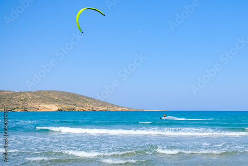 lonely surfer on a sunny beach