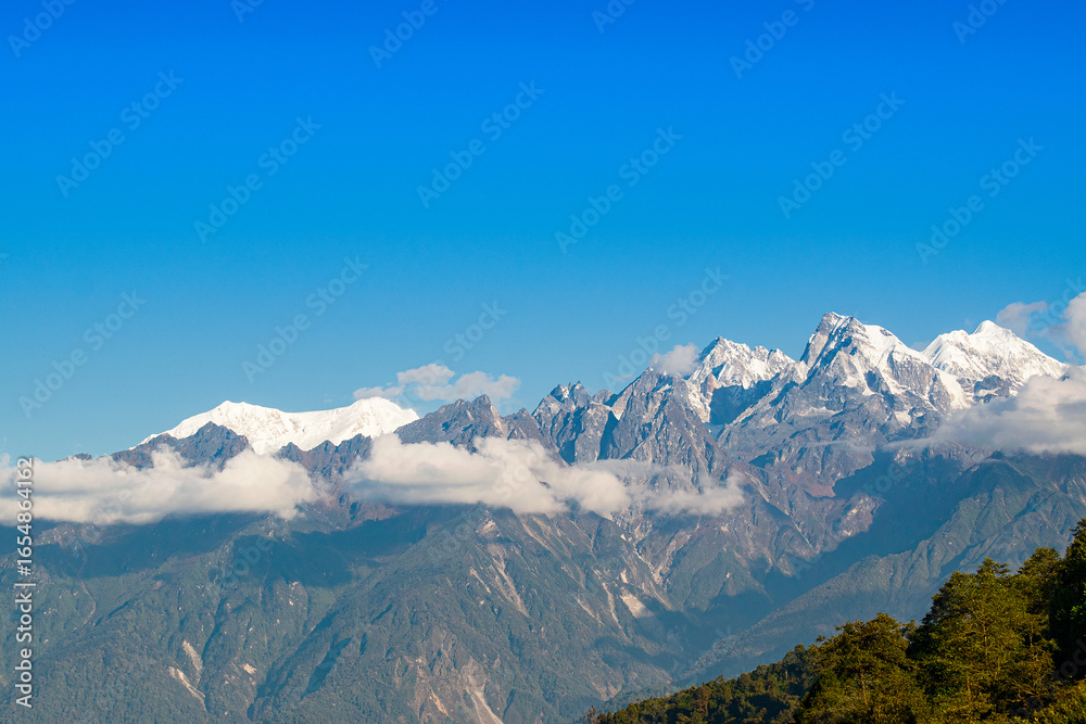 Beautiful view of Himalayan mountains at Ravangla, Sikkim. Himalaya is the great mountain range in Asia with more than 50 peaks , mostly highest, including mount Everest the highest in the world. Beautiful view of Himalayan mountains at Ravangla, Sikkim. Himalaya is the great mountain range in Asia with more than 50 peaks , mostly highest, including mount Everest the highest in the world.