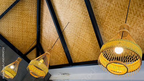 handicrafted wicker lamp holding with the ceiling