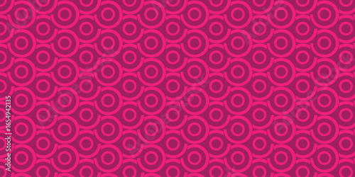 Pink Circle Pattern Seamless Background. This accurately describes the dominant visual elements and colors in the image. This indicates that the pattern is designed to repeat without visible seams.