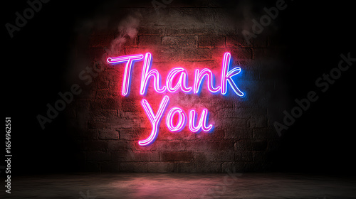 Colorful neon sign with 'Thank You' glowing against a dark wall, representing appreciation and gratitude in a modern setting.