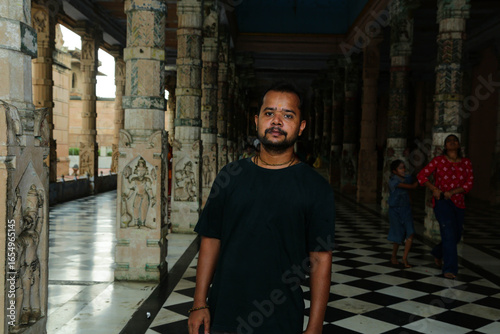 Tourist and local, Indian native women and man in traditional national dress. Beautiful ancient Temple in Vrindavan, Mathura, Uttar Pradesh,India.8 April 2025 
