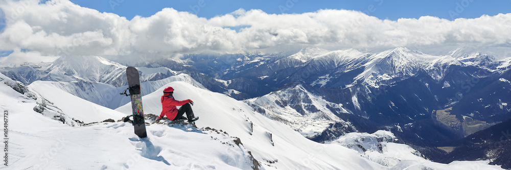Obraz premium Snowboarder on Mountain Peak Wide Banner with Copy Space
