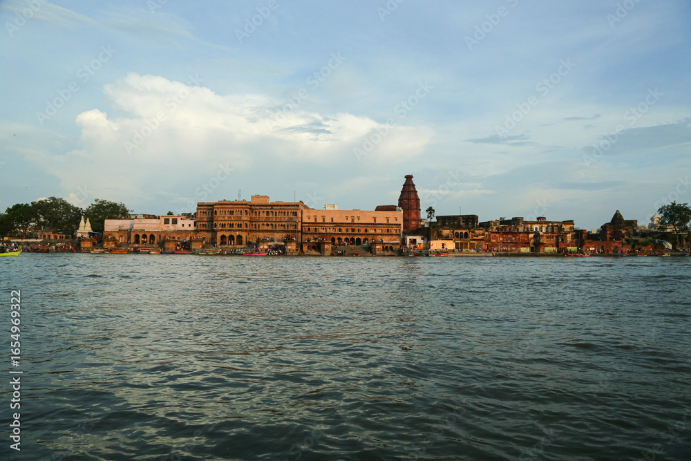 Naklejka premium Boat riding view in Ancient Shri Yamuna Temple ghat view, Vrindavan, Mathura, Uttar Pradesh, India. Ancient Shri Yamuna Temple ghat view, Vrindavan, Mathura, Uttar Pradesh, India.8 April 2025 