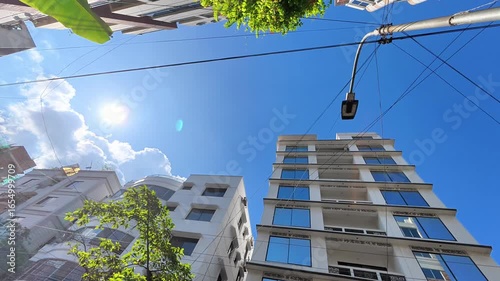 Buildings with Glass Windows and a Bright Sun