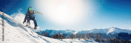 Snowboarder Jumping on Mountain Wide Banner