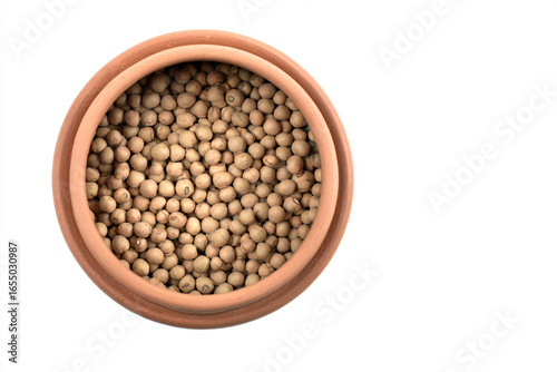 a bowl of beans on a white surface