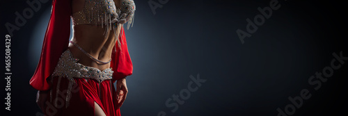 Fotografi Elegant Belly Dancer in Red Costume Wide Banner