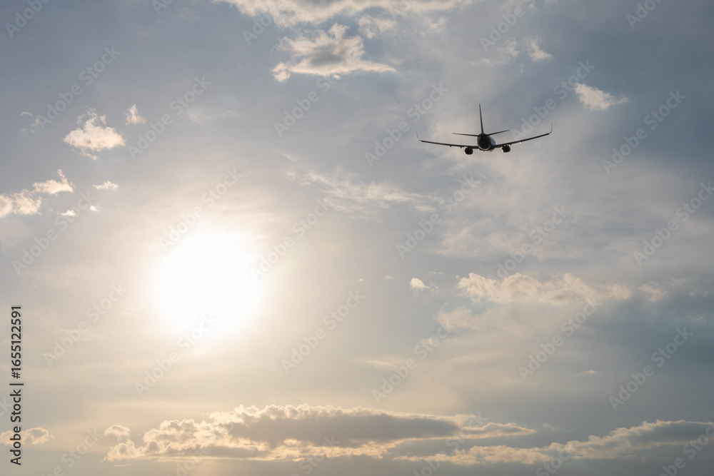 Fototapeta premium The aircraft moves steadily toward the sun, a powerful image of ambition, hope, and the pursuit of something greater than ourselves.