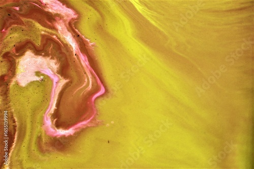 Abstract background of acrylic paint in yellow and pink tones. Fragment of artwork