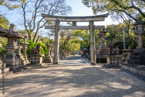 Canvas Print Ancient stone torii gate leads to Sumiyoshi Taisha, a Shinto shrine in Osaka, Japan