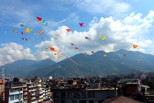 Colorful kites flying over kathmandu, nepal, with mountains and cloudy sky