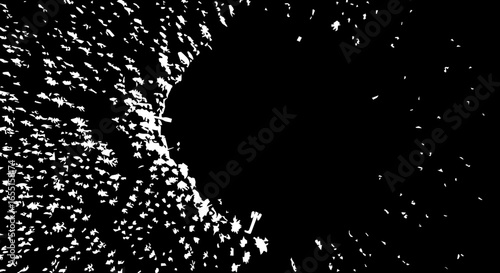 Highcontrast abstract burst of scattered white jagged particles forming a dynamic arc.