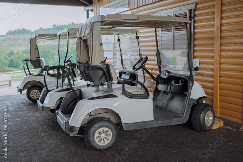 Golf Carts Parked by Clubhouse on a Cloudy Day