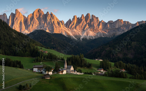 Beautiful sunset at Santa Maddalena village in the Dolomites, Val di Funes, Italy.