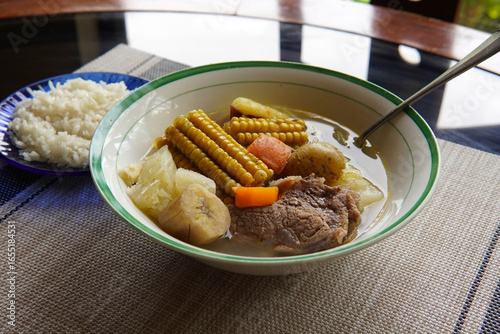 Olla de carne beef soup with vegetables, corn, potato, chayote, plantain, carrot, and beef. Typical dish of Costa Rica and Central America. Beef broth or meat soup accompanied with white rice.