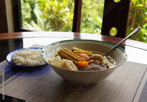 Olla de carne beef soup with vegetables, corn, potato, chayote, plantain, carrot, and beef. Typical dish of Costa Rica and Central America. Beef broth or meat soup accompanied with white rice.
