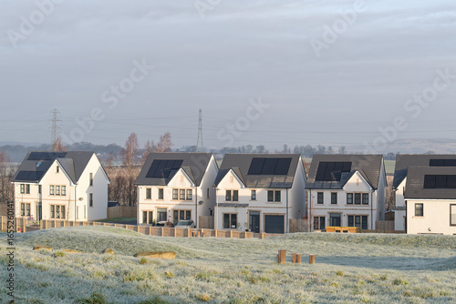 Solar panels installed on home roofs at new housing development