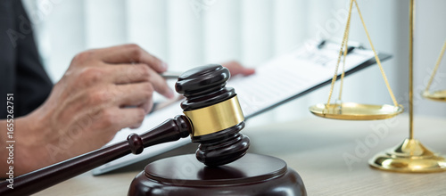 Male lawyer working with legal case document contract in office, law and justice, attorney, lawsuit concept