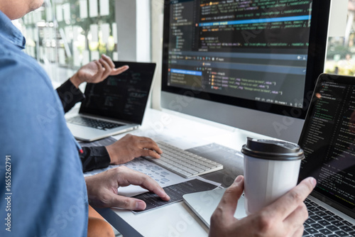 Team of developer programmer working on project in software development computer in IT company office, Writing codes and data code website and coding database technologies to find problem solution