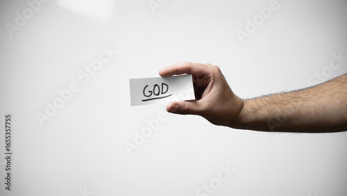 Hand on white background holding paper written with the word 
